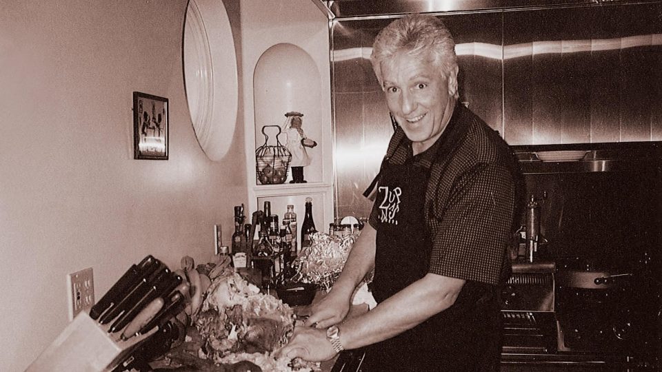 John Zupan cooking in the kitchen.