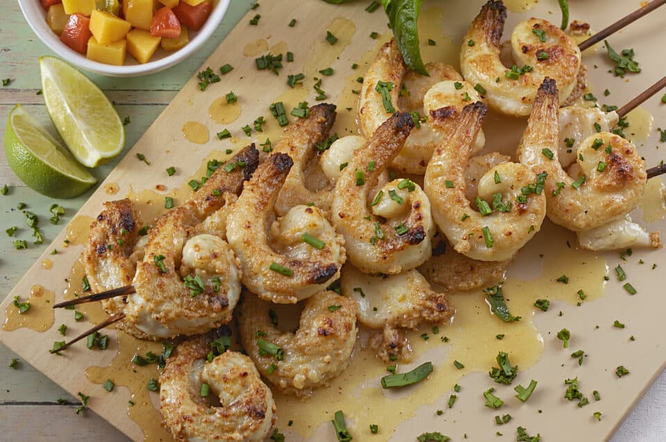 Shrimp skewars on a wooden cutting board